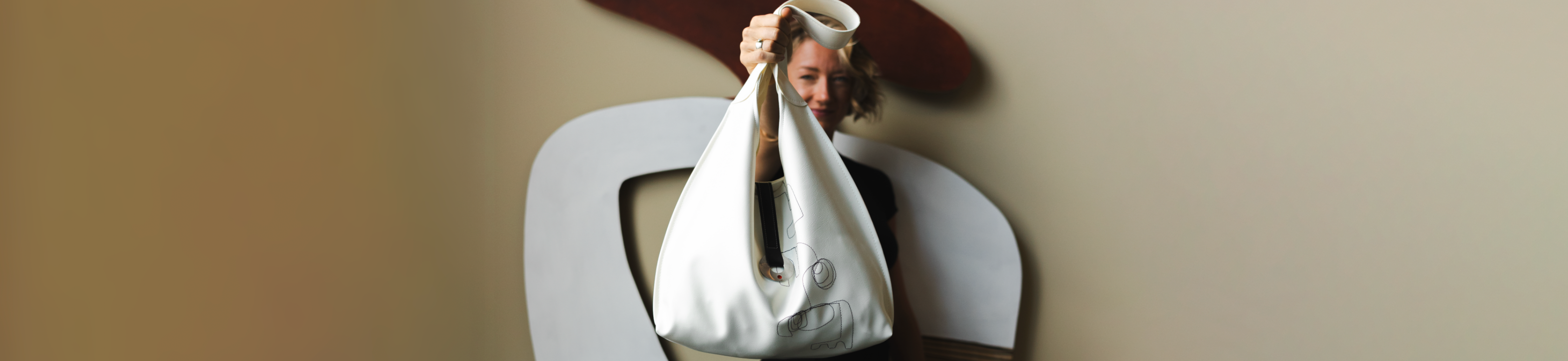 Person holding a white bag 